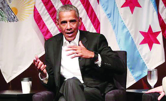 CHICAGO, IL - APRIL 24:  Dr Tiffany Brown (L) and Max Freedman (R) listen as former President Barack Obama speaks with youth leaders at the University of Chicago during a forum to promote community organizing on April 24, 2017 in Chicago, Illinois. The visit marks Obama's first formal public appearance since leaving office.  (Photo by Scott Olson/Getty Images)